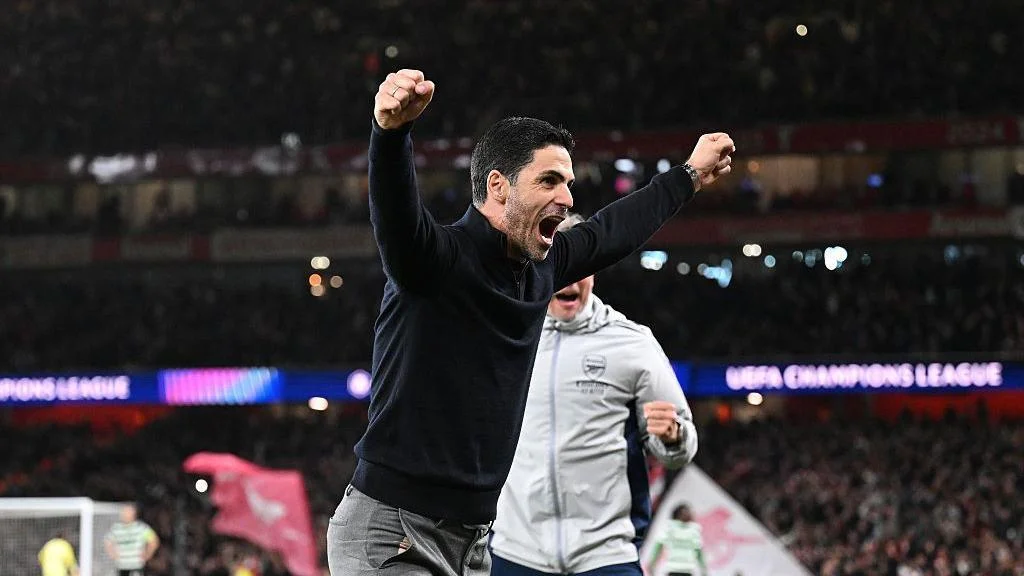 Mikel Arteta celebrates the win at full-time. 