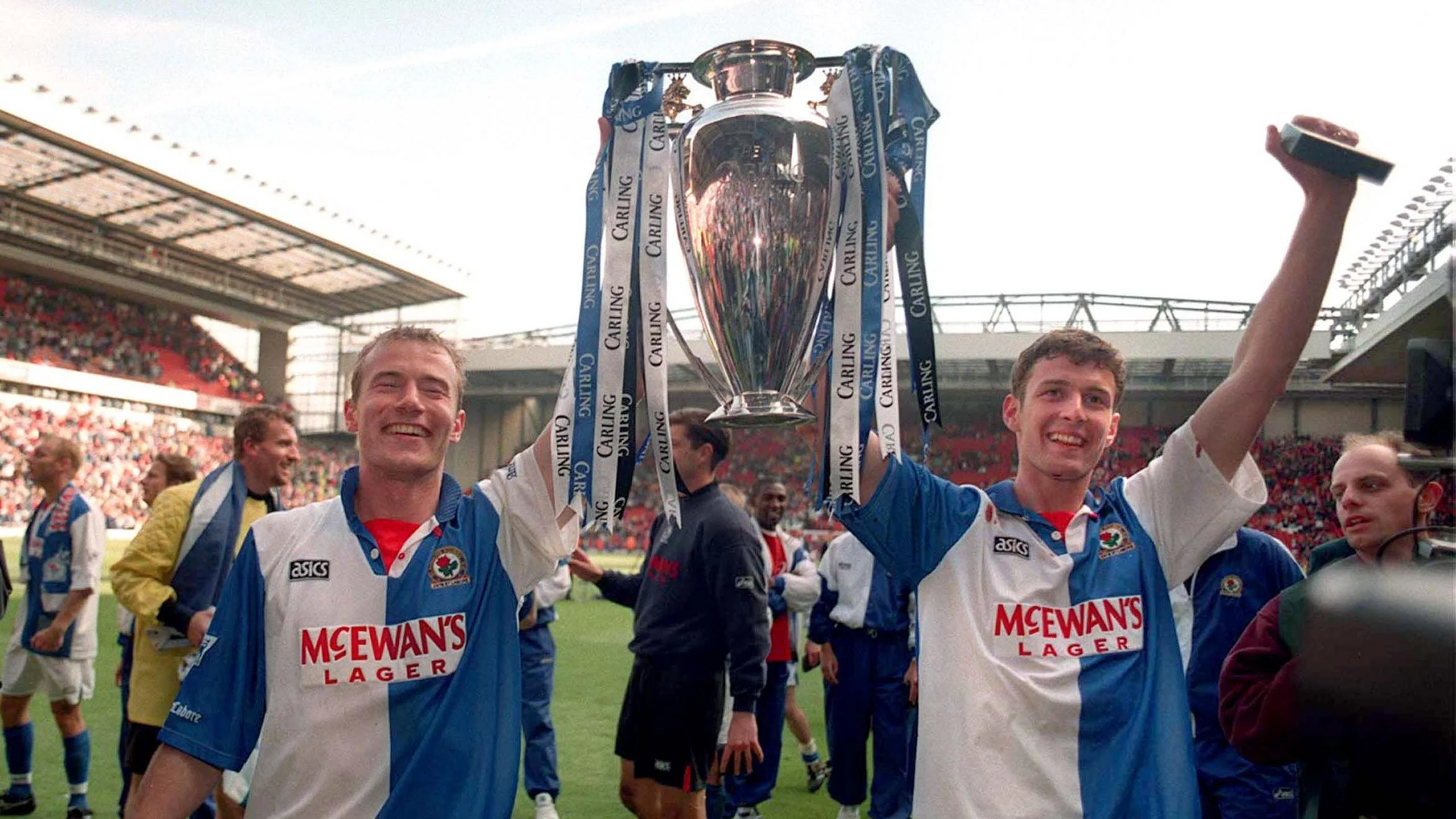 Blackburn Rovers strike partners Alan Shearer (left) and Chris Sutton celebrate with the Premier League trophy after being crowned champions in 1994-95